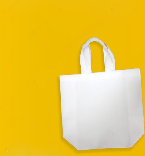 stock-photo-white-color-non-woven-fabric-shopping-bag-with-yellow-background-copy-space-for-text-and-logo-1847091562-transformed